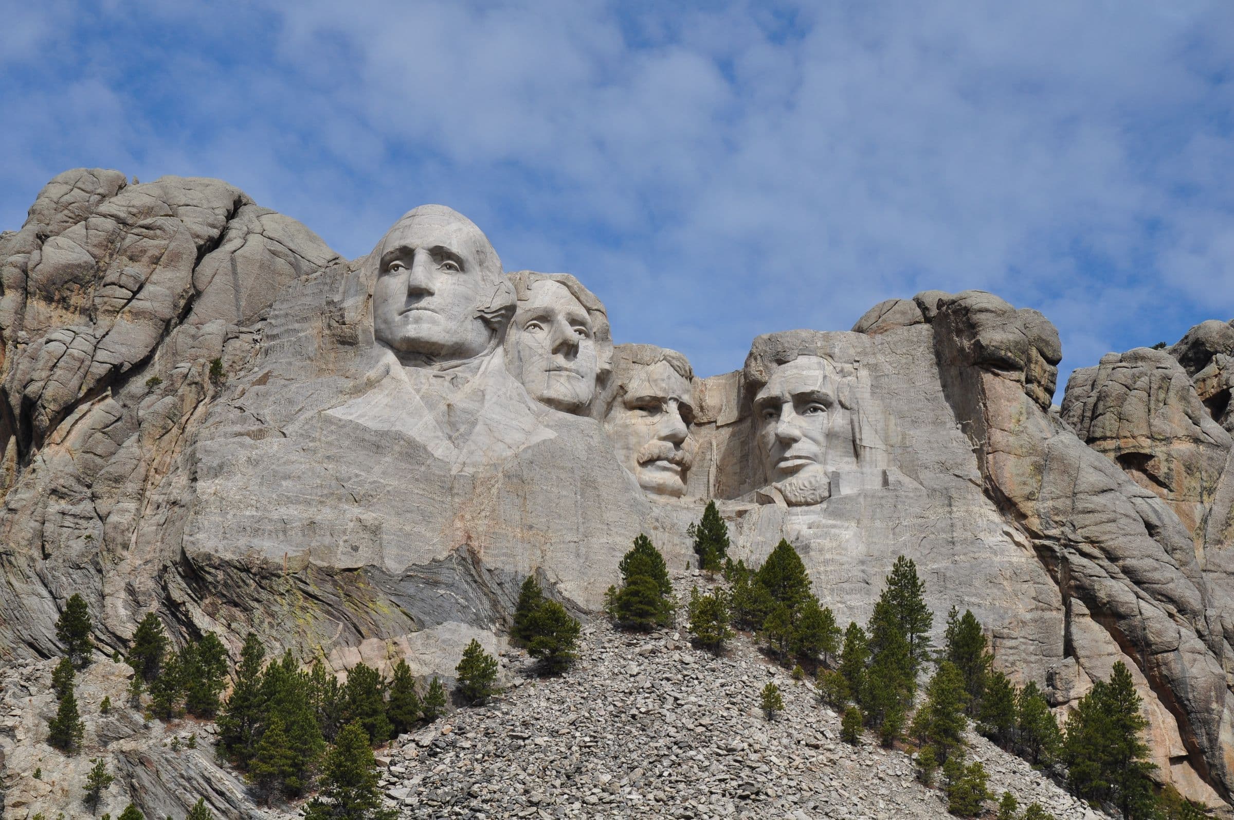 The Mount Rushmore carved faces under a clear sky, near our windshield repair Keystone SD service area